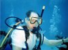 After training, Mark scuba diving for the first time at the Discover Scuba Experience - Roatan.