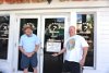 Mark & Mike standing in front of Husband Day Care Center, Key West