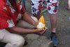 Our tour guide explains how to make chocolate from a coca plant in St. Lucia.