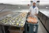 One of the kitchens (there are 3 major ones).  Preparing shrimp appetizers.