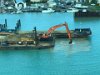 Digging sand like Tonya does deepening the port for a new cruiseship dock, St. Johns Antigua.