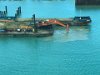 Digging sand like Tonya does deepening the port for a new cruiseship dock, St. Johns Antigua.