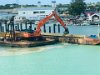 Digging sand like Tonya does deepening the port for a new cruiseship dock, St. Johns Antigua.