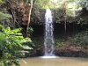 A waterfall at Kipu Ranch.  Popular place for photoshoots .  Water dirty due to recent rains