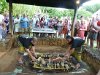 Uncovering the roasted pig at at Kilohana Plantation