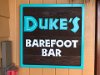 Dukes Barefoot Bar (good food, especially the seafood gumbo).  Duke invented and promoted surfing around the world.