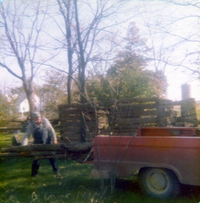 Image154 Log Cabin Oliver unloading poles for rafters he cut 1974