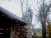 Oliver putting up the chimney with native rock